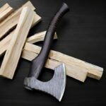 Hand forged Viking battle axe with sharp steel edge and wooden grip