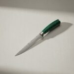 Monarch Butcher Boning Knife used by butcher for precise meat cutting and deboning chicken and beef in professional kitchen