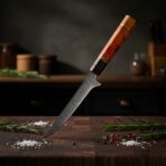 Monarch Professional Boning Knife used by chef for precise meat deboning in kitchen cutting chicken and separating meat from bone with control