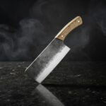 Close-up of the Monarch Cutlery Small Cleaver Utility Knife showing the razor-sharp full tang blade and ergonomic wooden handle.