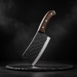 Close-up of the Monarch Cutlery Vegetable Cleaver Chopping Knife showing the razor-sharp full tang blade and ergonomic wooden handle.